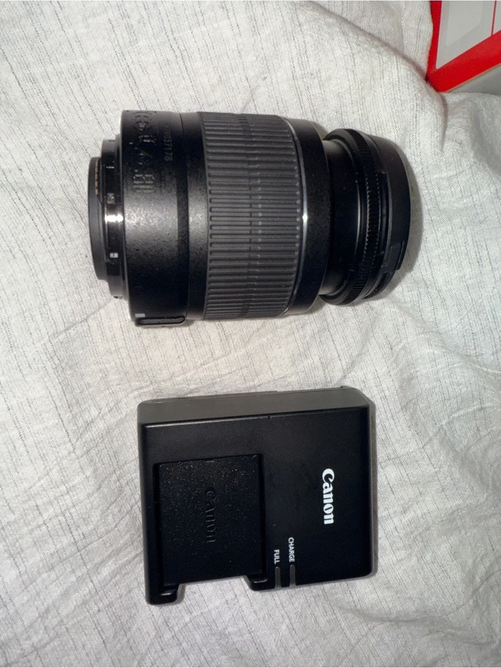 Canon DSLR Camera in Black with Red Strap Accent